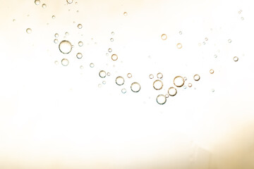 The surface of the cosmetic product has bubbles. blurred background. soft focus