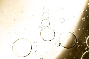 The surface of the cosmetic product has bubbles. blurred background. soft focus