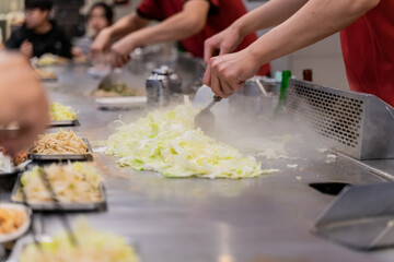 Cabbage teppanyaki is a comforting and flavorful dish that highlights the natural sweetness and crunch of fresh cabbage. Cooked on a sizzling iron plate, the leaves are charred just enough to release