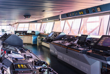 View of the control console on the navigational bridge of the cargo ship. 