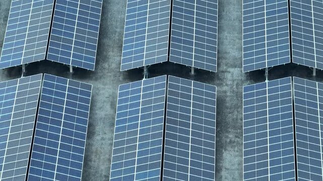 This drone view highlights the scale of a modern solar farm, showcasing the technology that supports green energy production, helping to reduce reliance on fossil fuels and mitigate climate change.
