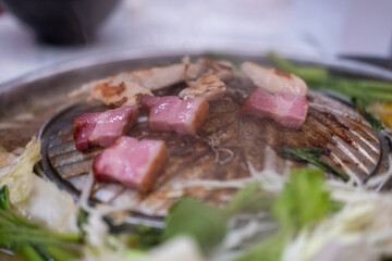 Thai style pork, bacon and seafood barbecue with vegetable soup