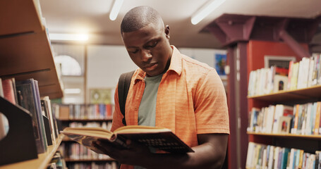 Black man, reading and book as student in library for research, studying and exam preparation. Person, novel and literature information for knowledge, education and language assessment at university
