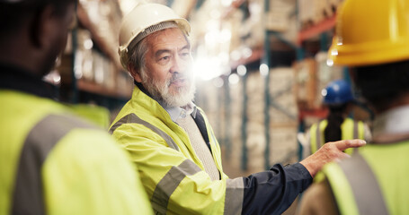 Logistics, colleagues and mature man in warehouse, discussion and collaboration for team with...
