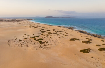 High angle view of road going through Corralejo dunes nature park in Fuerteventura. Aerial drone shot in october 2019