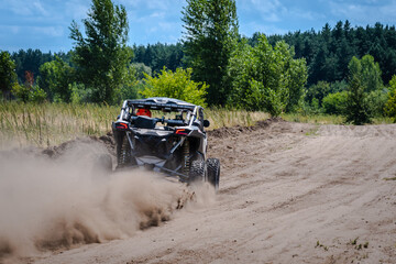 UTV buggy, ATV (quad), 4x4 in the action on sand