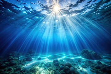Underwater tropical coral reef scene with sunlight rays and clear blue water