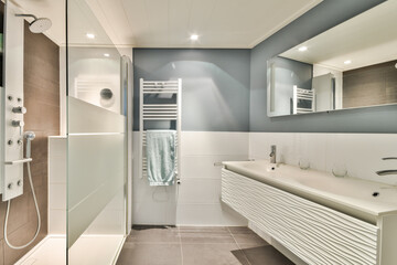 A sleek and contemporary bathroom featuring a clean design with elegant fixtures and a minimalist aesthetic, enhancing the sense of space and tranquility.