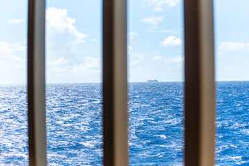 Obstructed view of ocean seascape, horizon and blue sky at summer season. Beautiful seascape background concept and empty space.