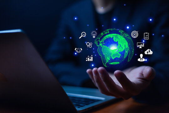 Hand holding globe with data connection network icon, Developing the changing intelligent data and global business development, Applying the digital technology of artificial intelligence.