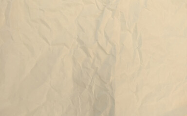 Brown background paper, crumpled texture and watercolor. Old vintage page with a glowing center and grunge vignette.