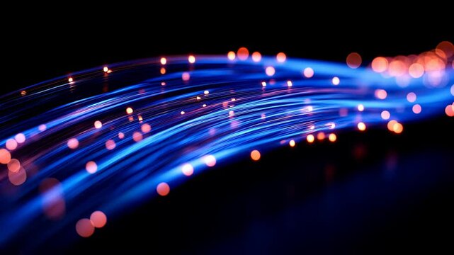 A series of blue and orange fiber optic lights are displayed in a row. The lights are arranged in a way that they appear to be moving or pulsating. Scene is energetic and dynamic