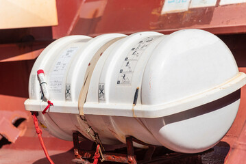 Close-up of a life raft mounted on a merchant vessel, essential life-saving equipment for the crew...