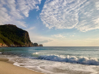 Sunny Shore with Distant Cliff