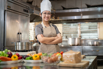 A female chef broadcasts her cooking knowledge live on a social media app on her mobile phone.