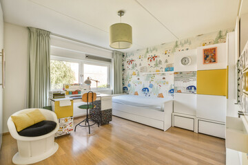 A stylish and spacious bedroom featuring a cozy bed, colorful wallpaper, and modern furniture, perfect for relaxation and productivity.