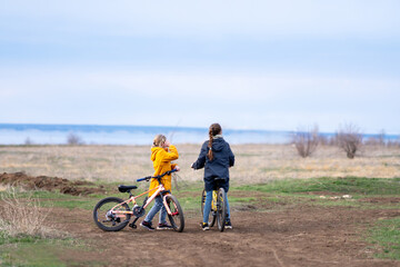 Fototapeta premium Two happy girls riding bicycles