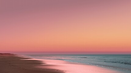 Fototapeta premium Sunset as a soft pink gradient fading into peach over an empty beach
