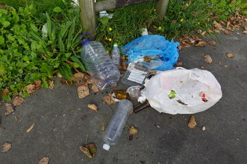 Plastic bottles and bags polluting the street