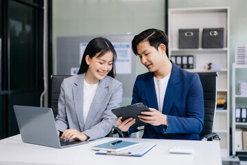 Kind leader executive manager share and discuss business solutions plan ideas on tablet with Asian...