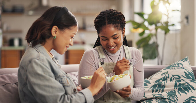 Bonding, ice cream and woman friends on sofa in living room of home together for reunion or visit. Conversation, relax and sharing with happy people in apartment for gossip, relationship or social