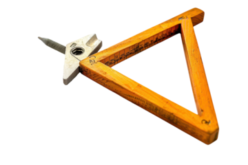 A wooden triangle and metal compass resting on detailed architectural blueprints in a bright workspace isolated on transparent background