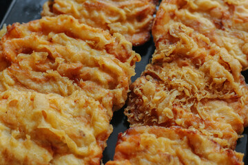 Pisang goreng or fried banana. Popular street food in Southeast Asia, especially in Indonesia, Malaysia, and Singapore. Selective focus.