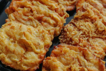 Pisang goreng or fried banana. Popular street food in Southeast Asia, especially in Indonesia, Malaysia, and Singapore. Selective focus.