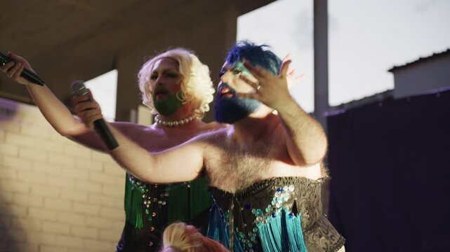 Bearded Drag Queens Perform Vibrant Numbers at Local Venue Engaging With Audience in Evening Show