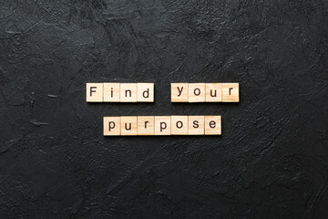 find your purpose word written on wood block. find your purpose text on table, concept