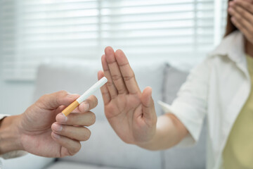 No smoke. woman cover nose due to cigarette smoke smell, refuse, reject, break, say no, quit...
