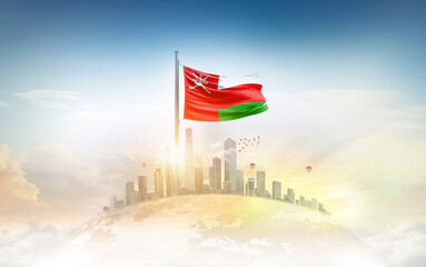 Oman flag wavering on globe with modern building skyline. Flag waving on world map. Oman national flag for independence day.