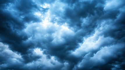 Obraz premium Storm clouds loom over the prairie, a vast sky in moody blues and greys, evoking nature's raw power and solitude.