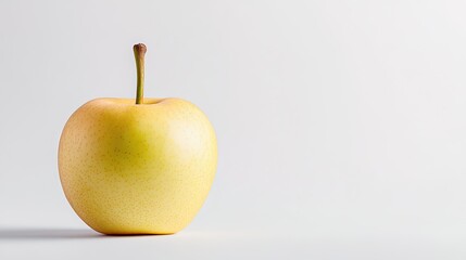 Fresh and Juicy Yellow Apple on a Light Background Perfect for Healthy Lifestyle Concepts