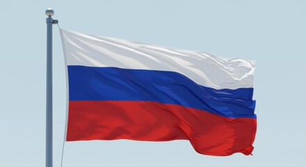 Fototapeta premium Russian Federation Flag Waving Proudly Against a Clear Sky: A Symbol of National Identity and Patriotism