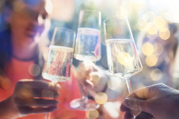 Friends with glasses of wine clink glasses holiday, a group of people abstract blurred background