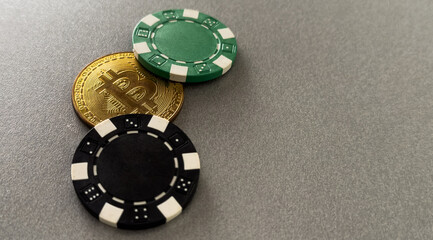 Bitcoin coins with poker cards and chips