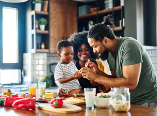 child family kitchen food boy son mother father breakfast preparing egg morning healthy diet eating...