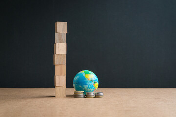 Globe with coins and seven square blocks stacked up.