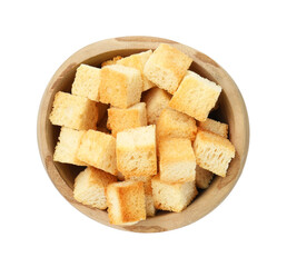 Delicious crispy croutons in bowl isolated on white, top view