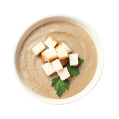 Delicious mushroom cream soup with croutons and parsley in bowl isolated on white, top view