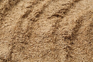 Superfood. Coriander powder as background, closeup view