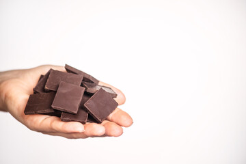 slices of delicious dark chocolate on a light background.