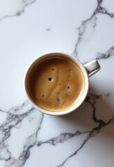 Obraz premium A hot coffee cup on marble table, top view