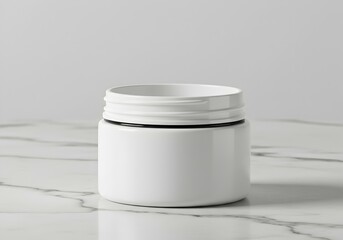 Short round skincare jar on marble surface