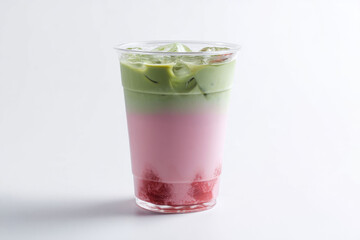 Refreshing iced beverage with layers of strawberry, pink milk, and green matcha, served in clear plastic cup on white