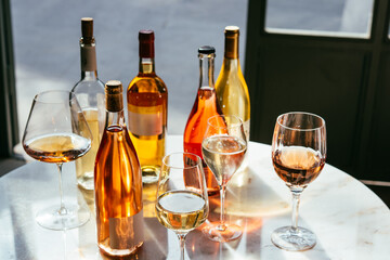 Different types of wine in glasses - red, white, rose and amber. Wine tasting in a bar or restaurant.