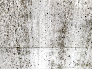 Weathered concrete wall with natural stains and textures