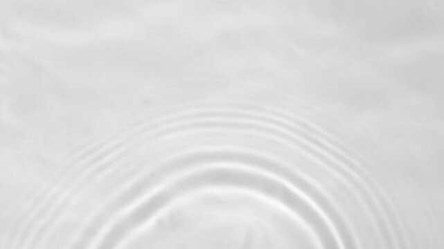 Close-up view on water texture with waves and gray overlay effect for video mockup. Organic light gray drop shadow caustic effect with wave refraction of light. Slow motion water video.