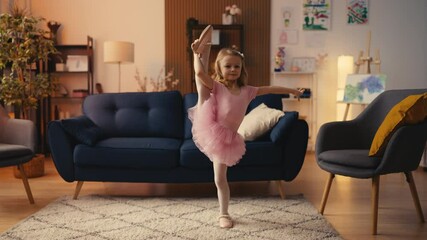 Little girl in tutu dress showing ballet pose at home, proud hobby moment
